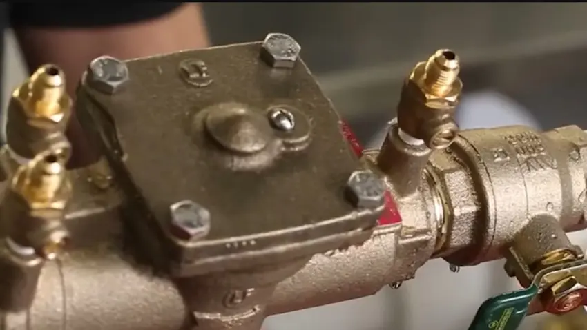 Backflow preventer assembly being tested and serviced for Plumbing Services in Castle Rock, CO