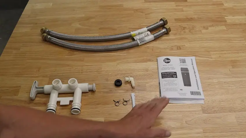 Plumbing repair work with tools and exposed piping for Plumber in Elizabeth, CO