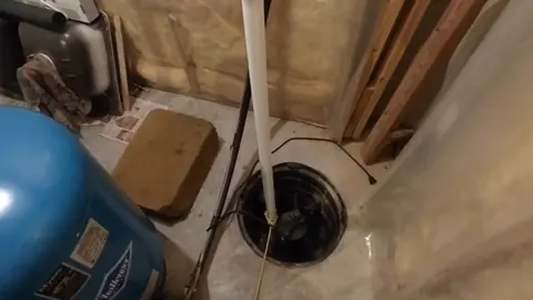 Sump pump pit with discharge piping and float components for Castle Rock Plumbing Blog