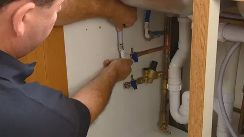 Water softener tank and control valve installation for Castle Rock Plumbing Blog